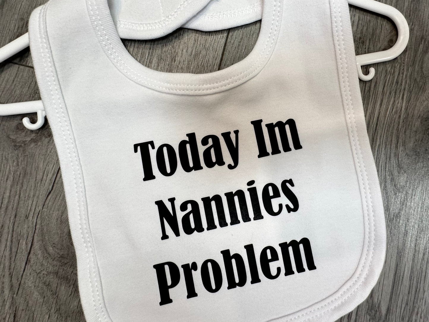 ''Today im nannies problem'' slogan white baby bib