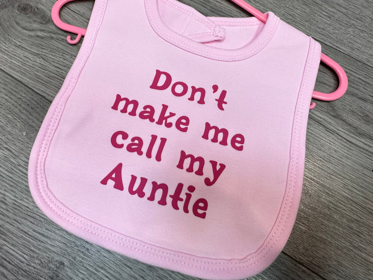 Pink "Don't make me call my auntie" Baby Bib