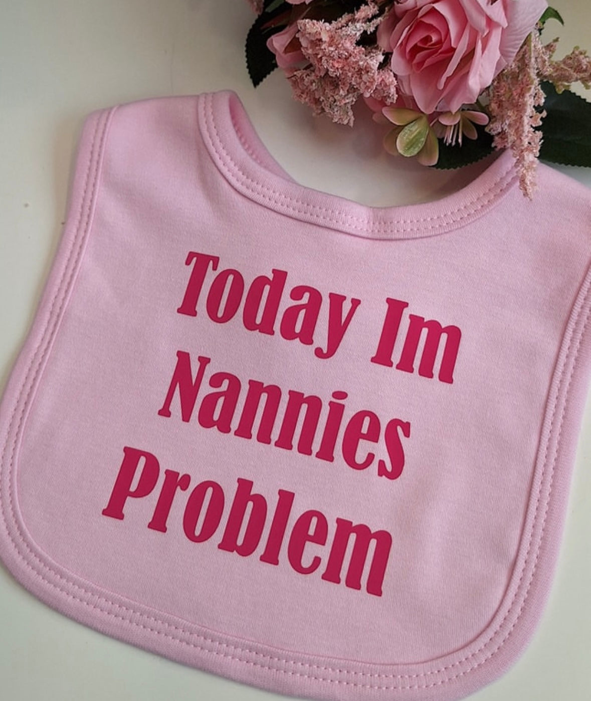 ''today im nannies problem'' pink baby bib