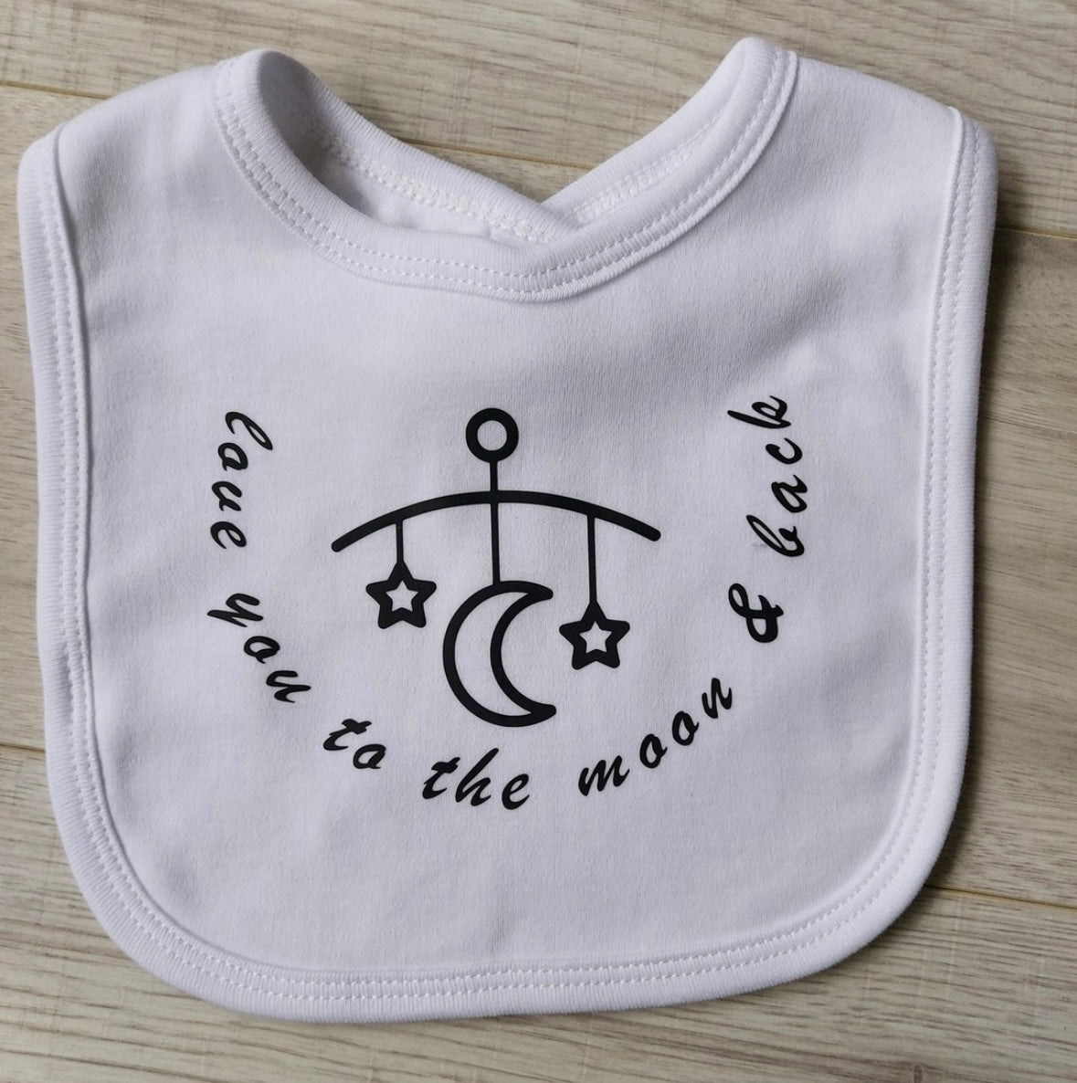 ''love you to the moon and back'' slogan white baby bib