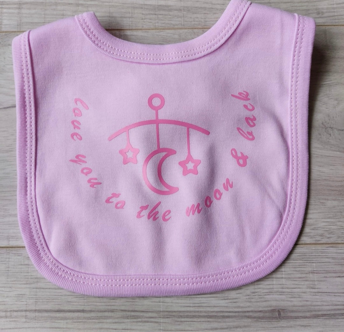 ''love you to the moon and back'' slogan pink baby bib